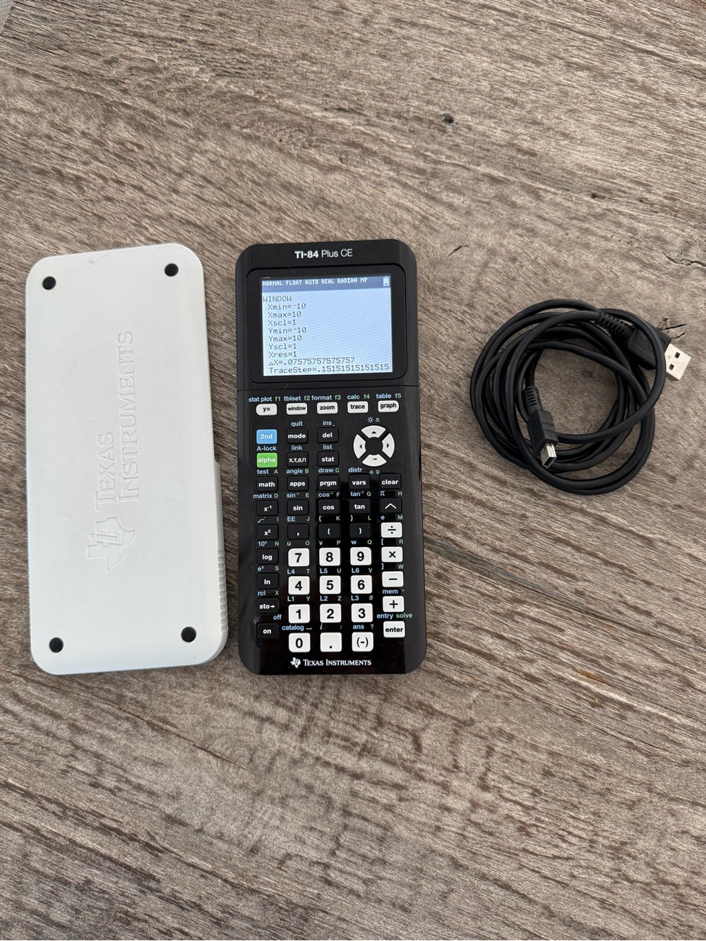 Texas Instruments TI-84 Plus CE calculator with case and charger